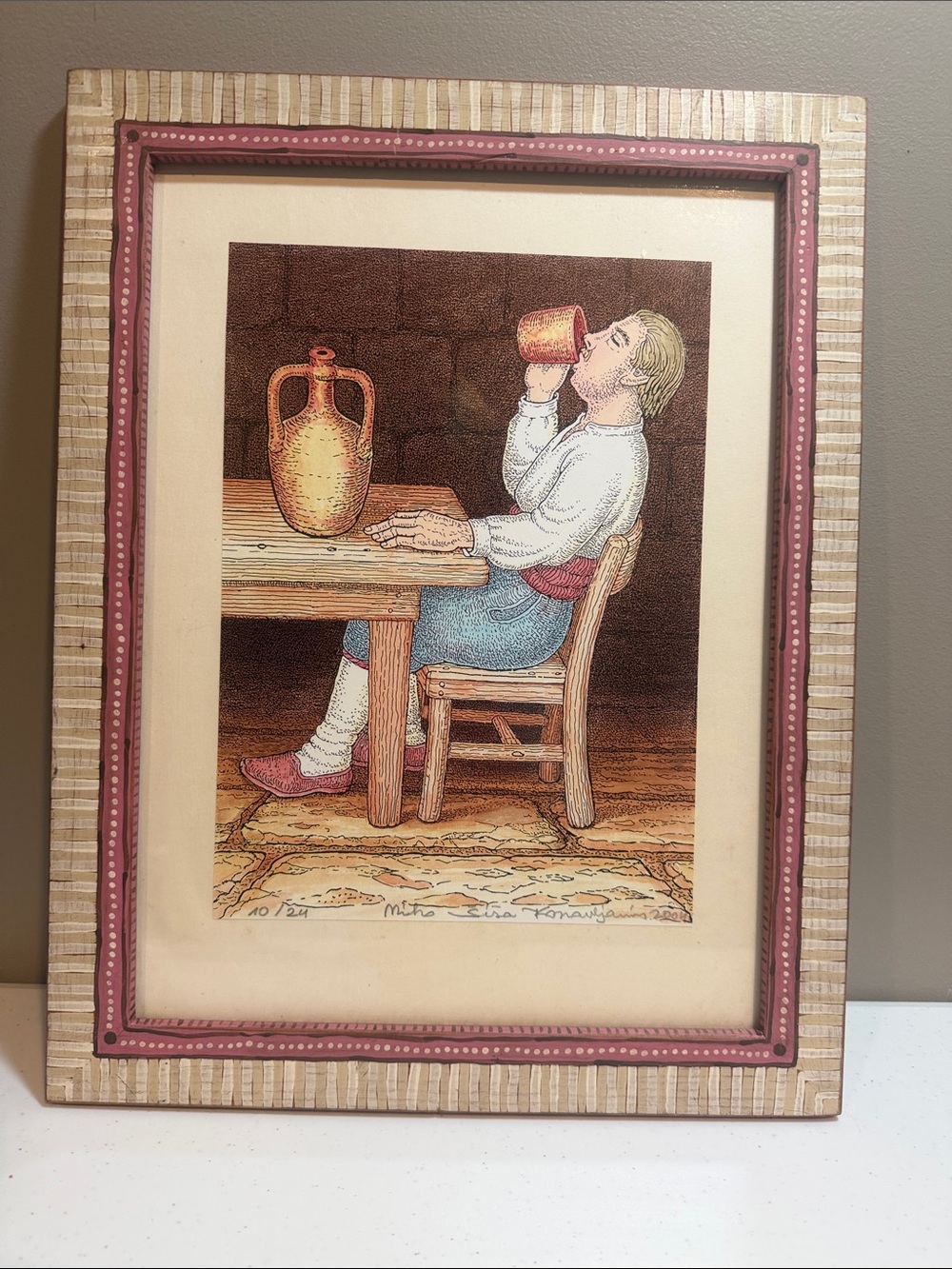 Seated Figure Art Print in Pink and Beige Framed Wall Art by Mino konavijanin